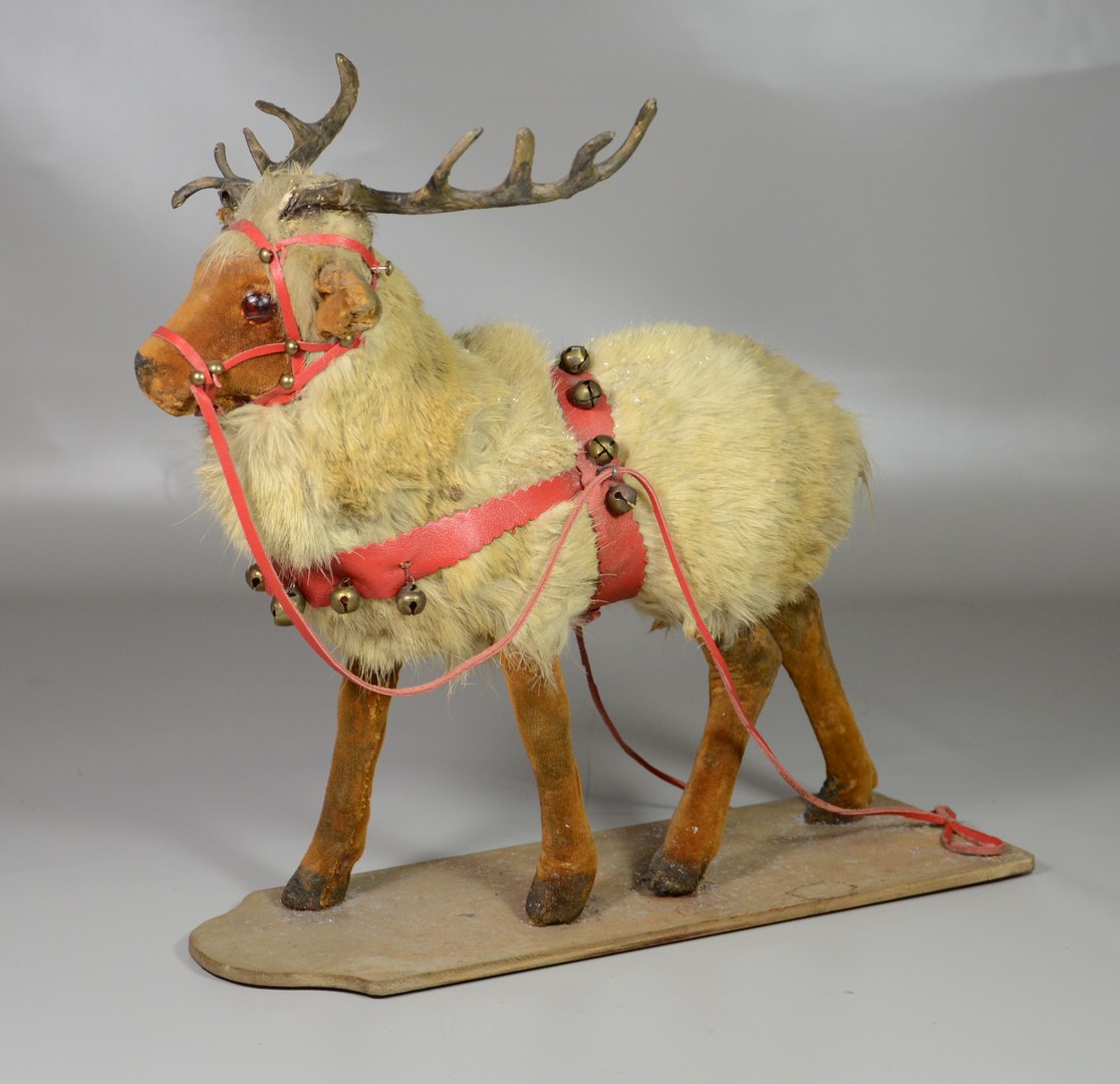 Appraisal: Reindeer on platform real fur with felt covered legs bells