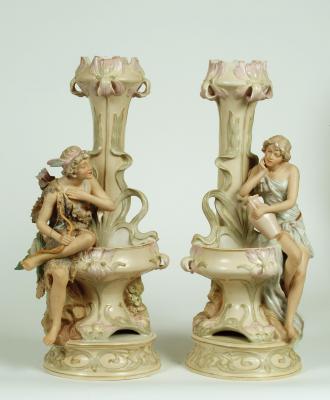 Appraisal: A PAIR OF ROYAL DUX PORCELAIN FIGURAL VASES modelled as