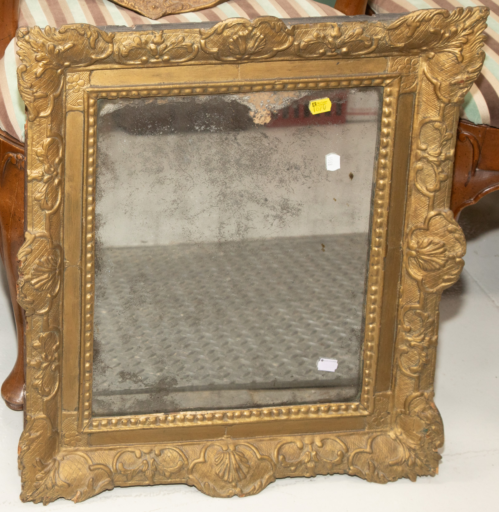 Appraisal: ANTIQUE MIRROR IN ORIGINAL CARVED FRAME Probably Italian later th