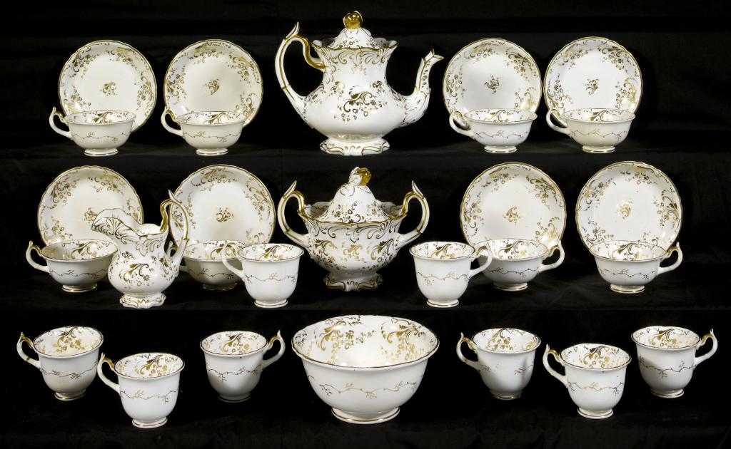 Appraisal: A ROCKINGHAM TEA AND COFFEE SERVICE of single spur handle