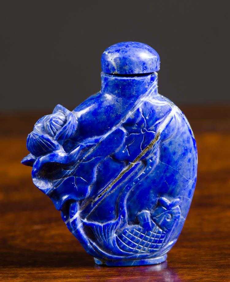 Appraisal: CHINESE CARVED BLUE LAPIS SNUFF BOTTLE of compressed form Height