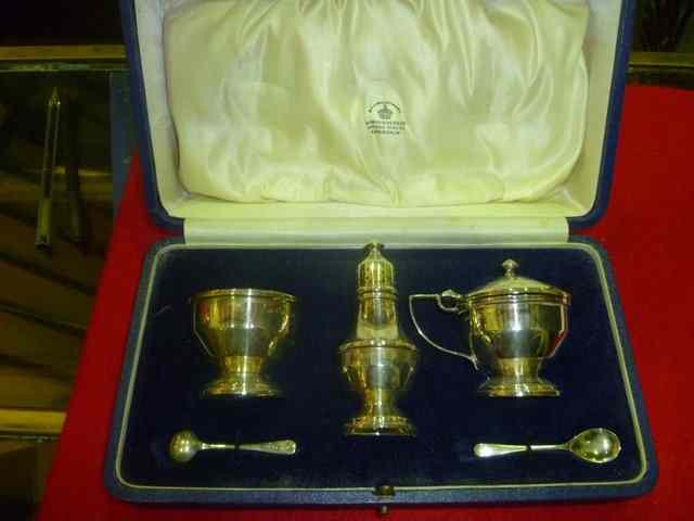 Appraisal: A SILVER THREE PIECE CONDIMENT SET of baluster form on