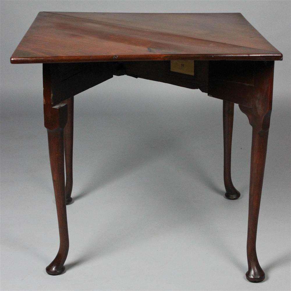 Appraisal: GEORGIAN MAHOGANY HANDKERCHIEF TABLE the triangular top with conforming frontal