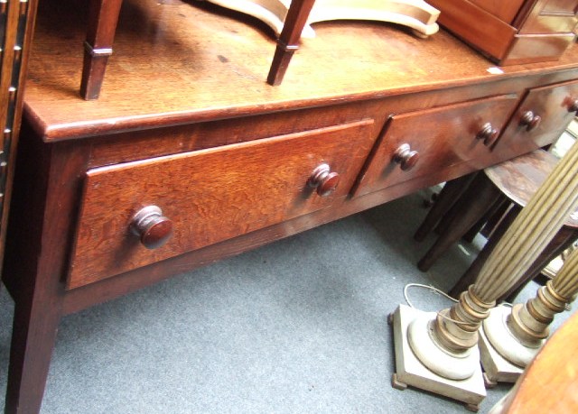 Appraisal: An early th century oak dresser base the plain ledge