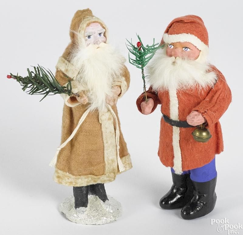 Appraisal: Two German composition Belsnickle Santa Two German composition Belsnickle Santa