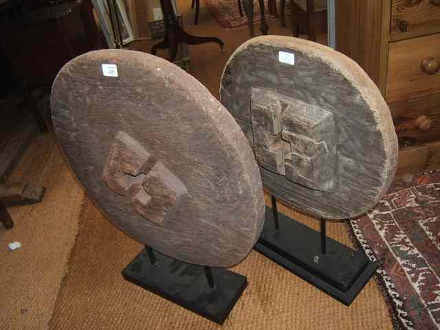 Appraisal: TWO CIRCULAR SOLID WOOD SCULPTURAL CARTWHEELS on stepped bases one