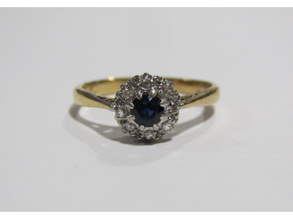 Appraisal: Eighteen carat gold sapphire and diamond cluster ring