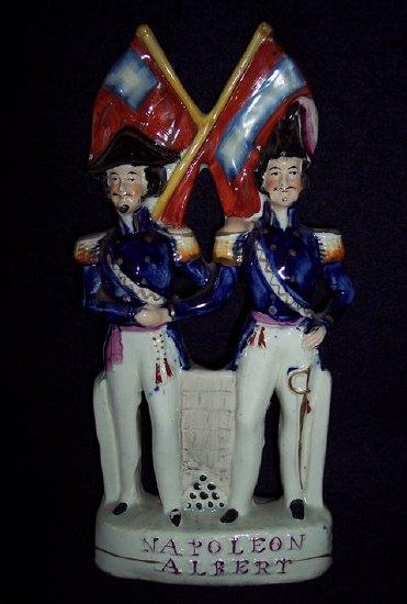 Appraisal: A Staffordshire named group Napoleon and Albert shaking hands beneath