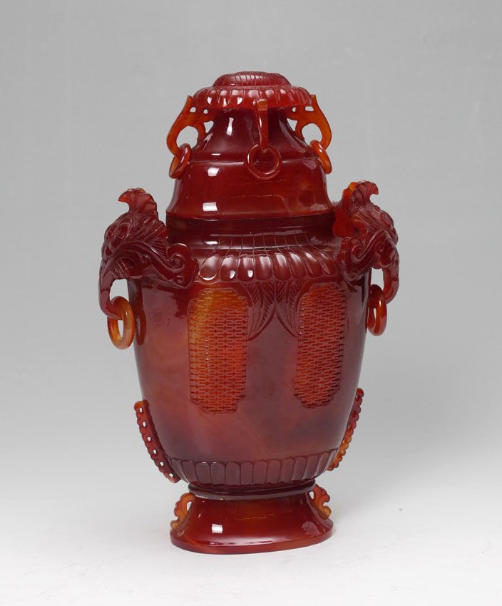 Appraisal: CHINESE CARVED CARNELIAN AGATE VASE WITH LID Carved carnelian agate