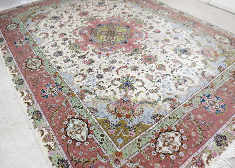 Appraisal: A CONTEMPORARY PERSIAN WOOL AND SILK CARPET floral and central