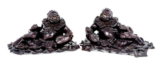 Appraisal: Pair Chinese carved hardwood Nubian figures late th century reclining