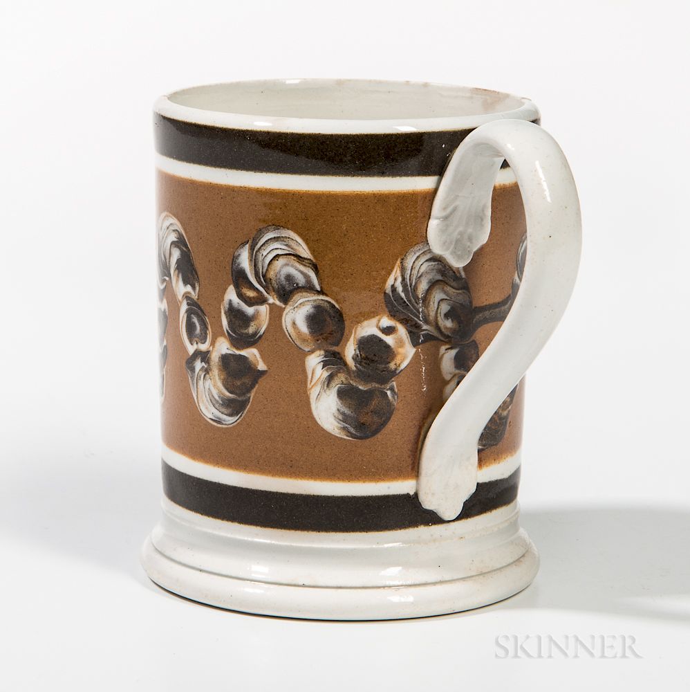 Appraisal: Slip-decorated Pearlware Half-pint Mug Slip-decorated Pearlware Half-pint Mug England early