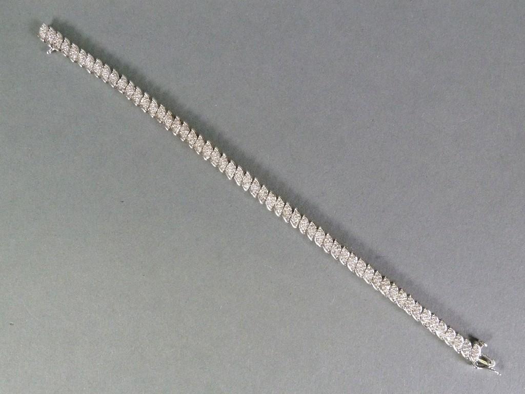 Appraisal: ct WHITE GOLD AND DIAMOND NARROW FLEXIBLE BRACELET with fifty