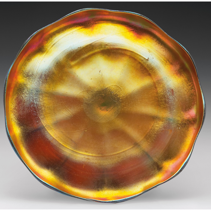 Appraisal: L C Tiffany plate gold favrile glass with brilliant iridescence