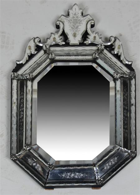 Appraisal: A Venetian wall mirror with a floral etched cartouche over