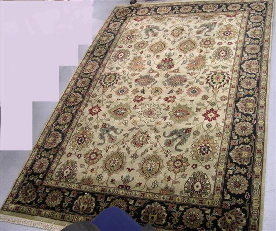 Appraisal: Persian Sarouk ' x ' taupe field with muted multicolored