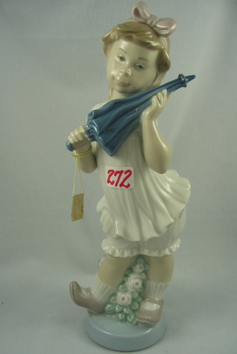 Appraisal: A SPANISH LLADRO GLAZED PORCELAIN FIGURE of a young girl