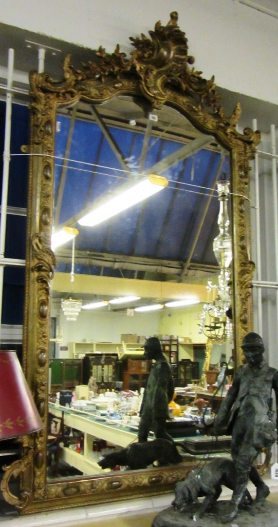 Appraisal: A th century gilt framed overmantel mirror with 'C' scroll