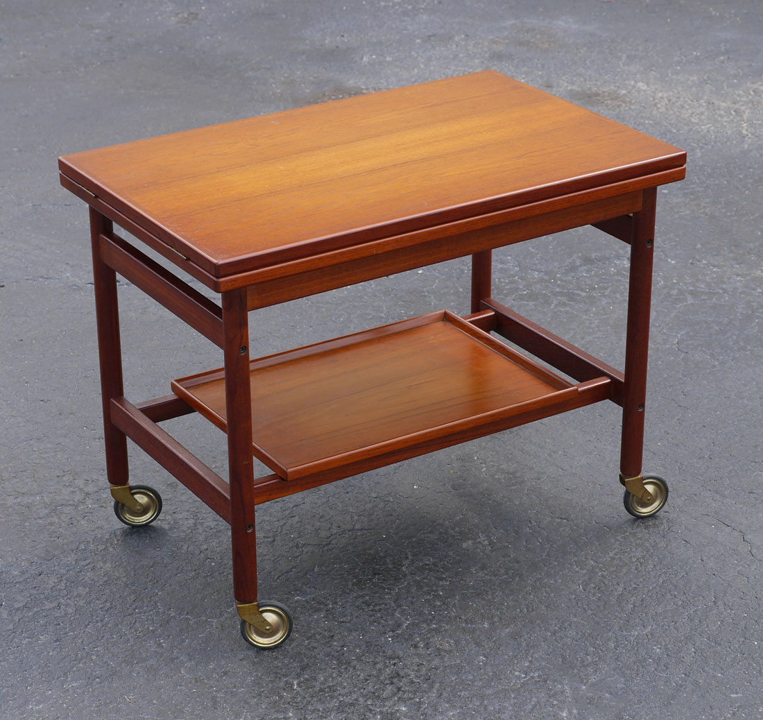 Appraisal: KURT OSTERVIG TEAK FLIP TOP TEA CART Serving cart designed