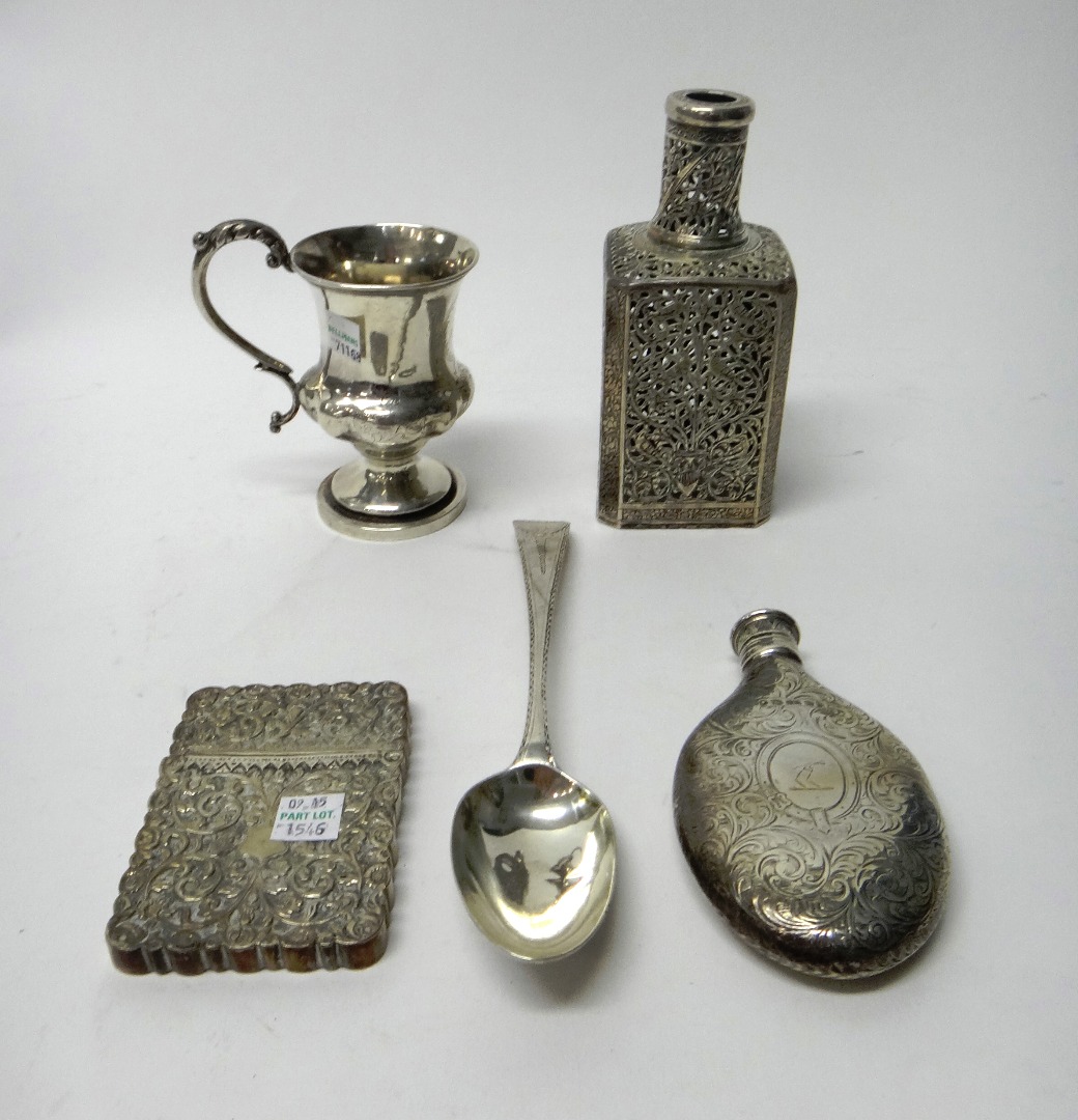 Appraisal: A Victorian silver spirit flask of oval form with engraved