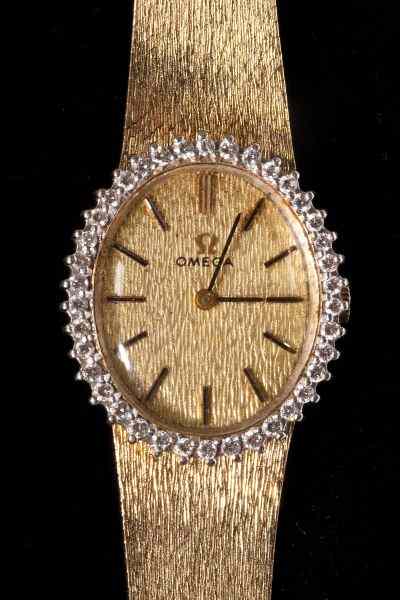 Appraisal: KT Gold Lady's Wristwatch Omegacase of oval form with gold