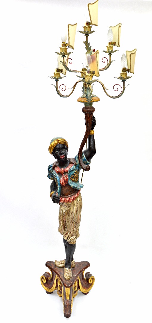 Appraisal: A reproduction carved wood and polychrome painted figure of a