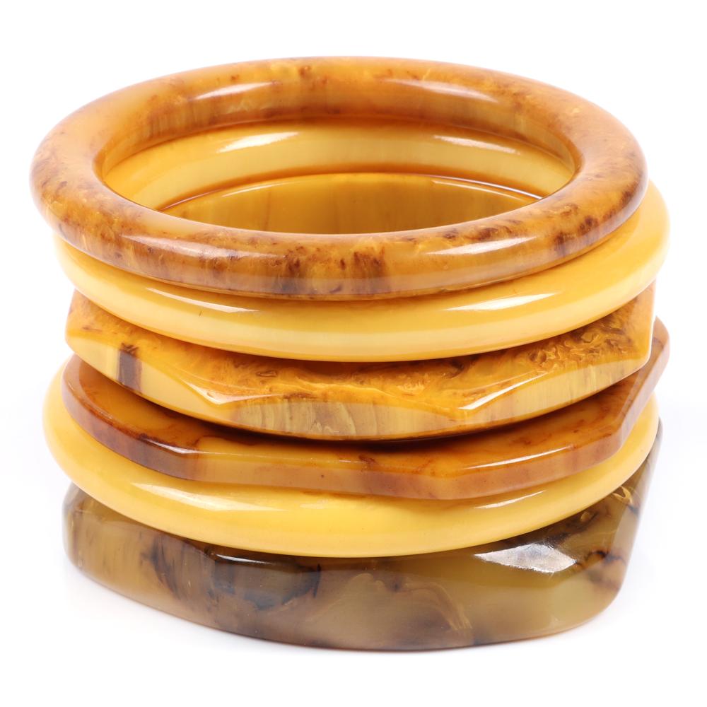 Appraisal: SIX BAKELITE BUTTERSCOTCH AND SWIRL BANGLE BRACELETS TWO CREAM TWO