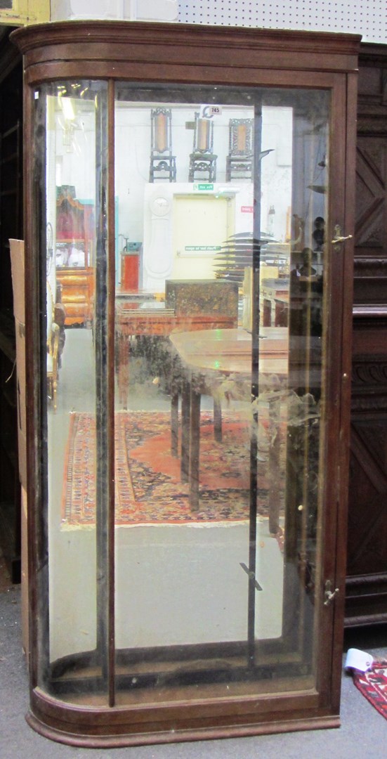 Appraisal: A th century mahogany framed floor standing single door display