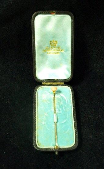 Appraisal: A coral bead mounted stick pin the case inscribed Xmas