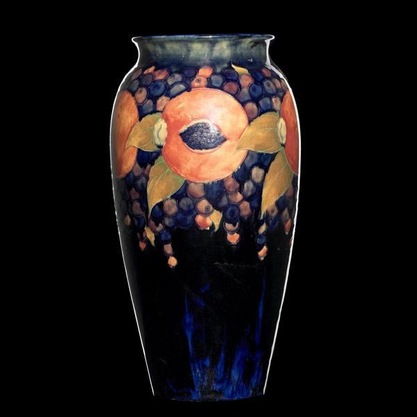 Appraisal: MOORCROFT Tall vase in the Pomegranate pattern on indigo Stamped