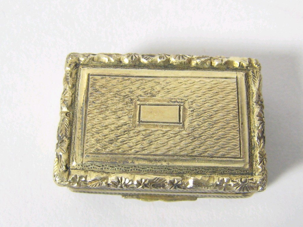 Appraisal: A George IV silver-gilt rectangular Vinaigrette with engine turning vacant