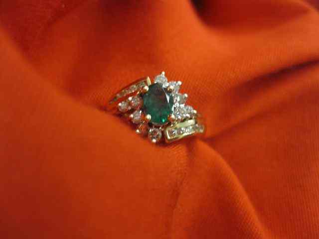 Appraisal: Emerald Diamond Ring oval gem weighing approx carat and diamonds