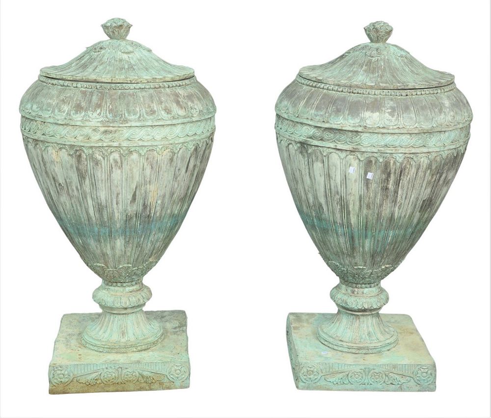 Appraisal: Pair of Bronze Covered Urns having fluted design with fruit