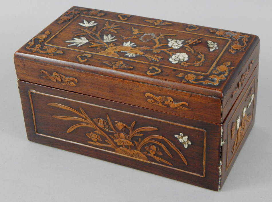 Appraisal: A Chinese hardwood box carved overall with flowers etc and