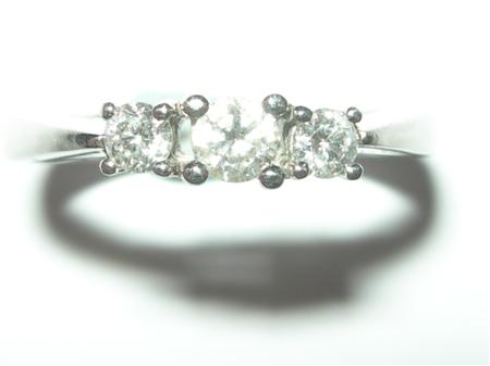 Appraisal: A modern platinum mounted three-stone diamond ring claw set with