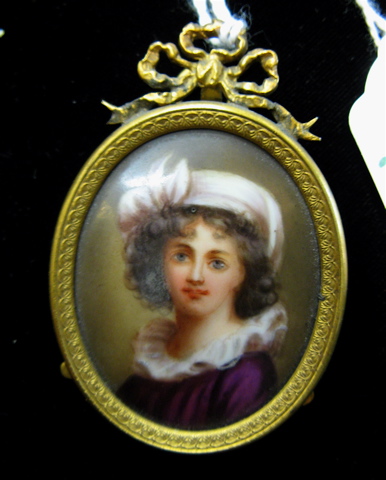 Appraisal: OVAL MINIATURE PORTRAIT OIL ON PORCELAIN of a young woman