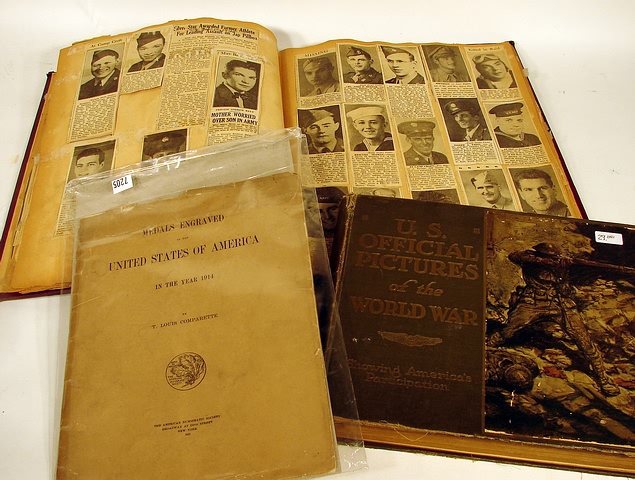 Appraisal: Lot consisting of a WWII photo album showing paper clips