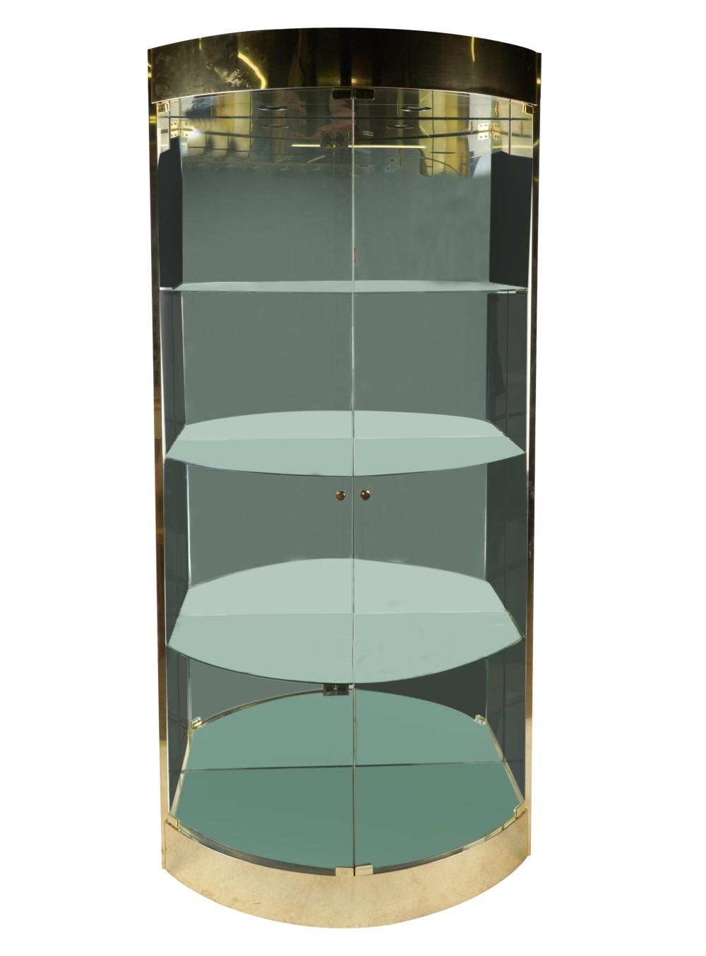 Appraisal: BRASS GLASS DISPLAY CABINETdemilune with mirrored interior and three glass