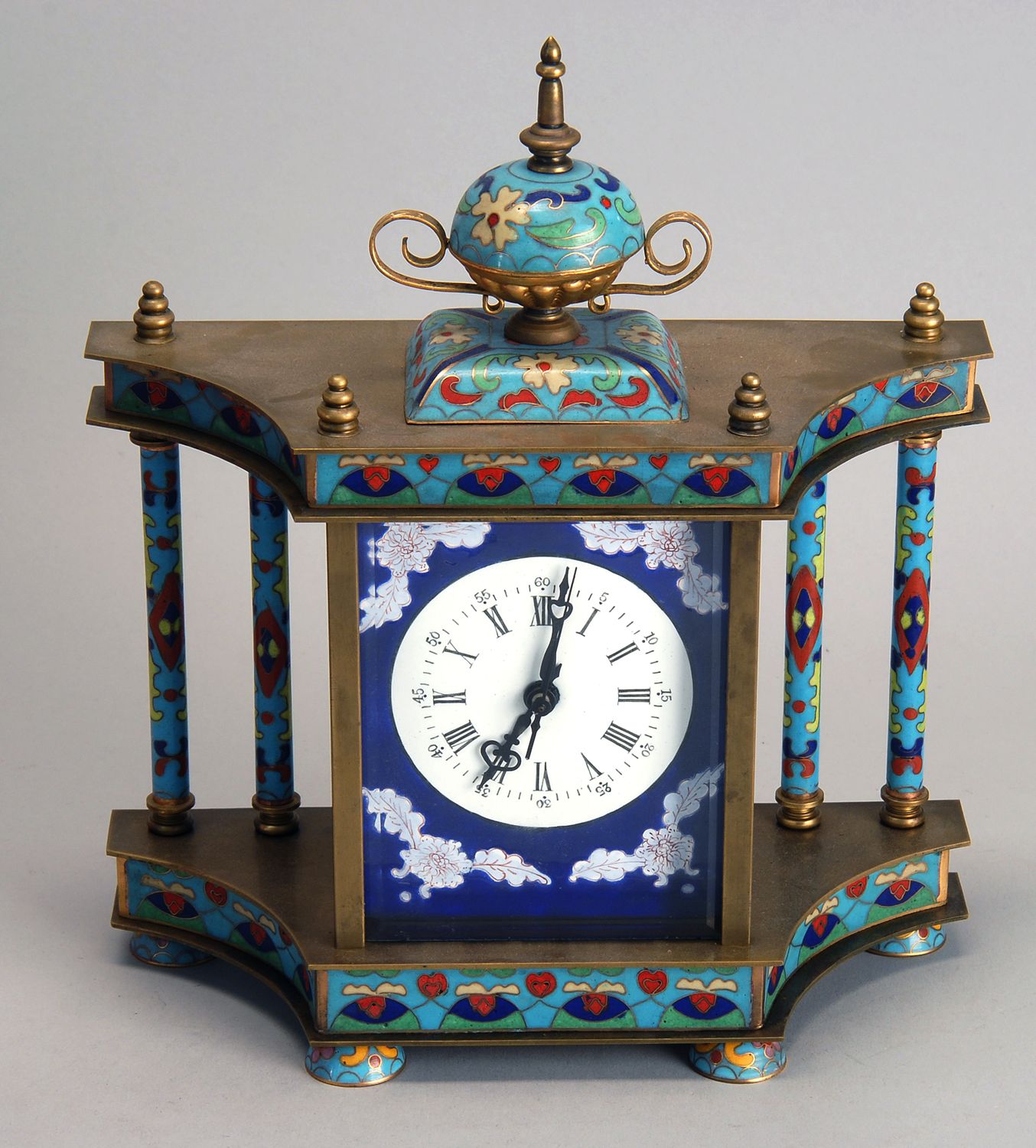 Appraisal: ENAMEL AND BRASS SPRING-DRIVEN CLOCK Height ConditionUndamaged Not guaranteed to