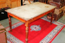 Appraisal: A provincial pine kitchen table on turned tapered legs