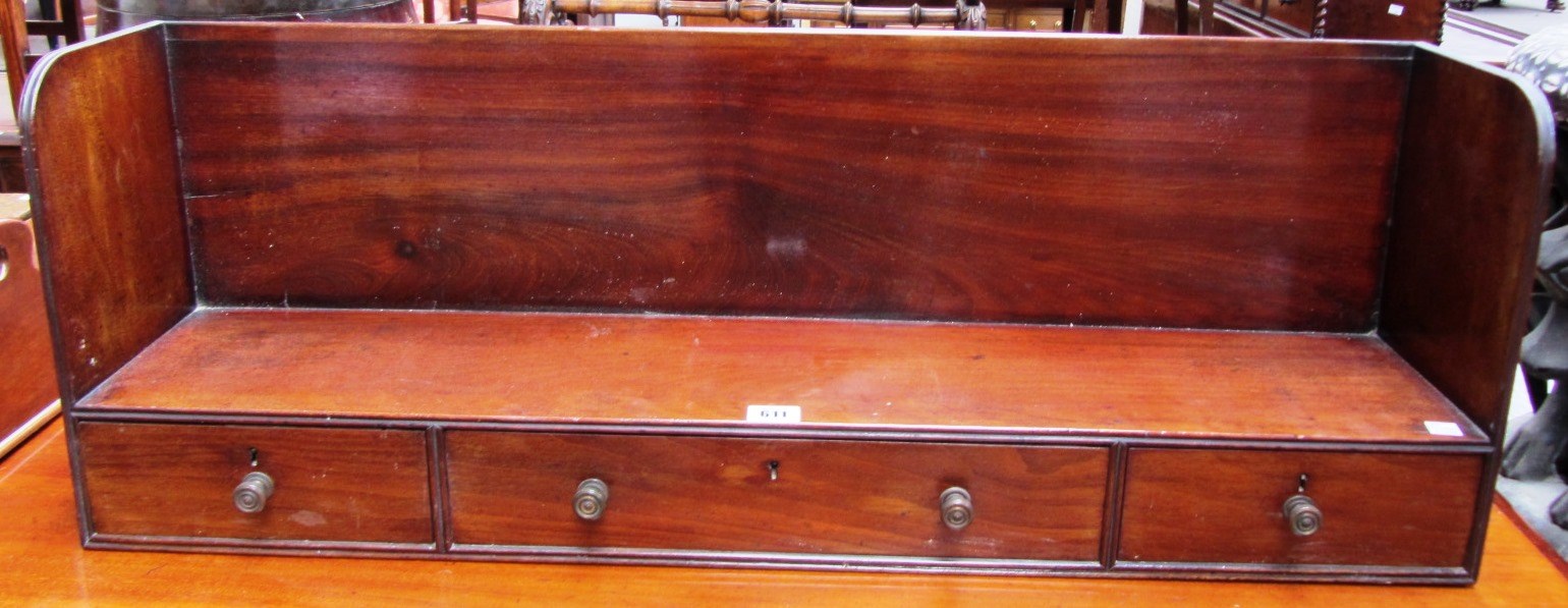 Appraisal: A th century mahogany bookshelf with three frieze drawers cm