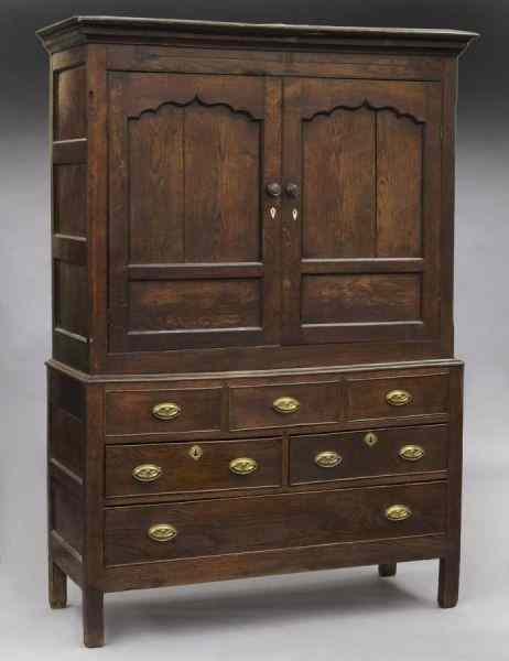 Appraisal: Early English paneled oak cupboard on chest the molded cornice