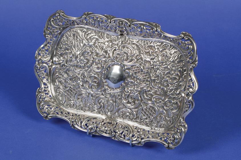 Appraisal: A LATE VICTORIAN DRESSING TABLE TRAY of shaped rectangular form