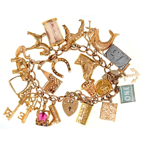 Appraisal: A gold charm bracelet with gold padlock and a collection