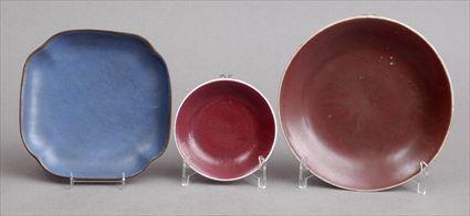 Appraisal: TWO CHINESE FLAMB -GLAZED FOOTED DISHES AND A BLUE-GLAZED DISH