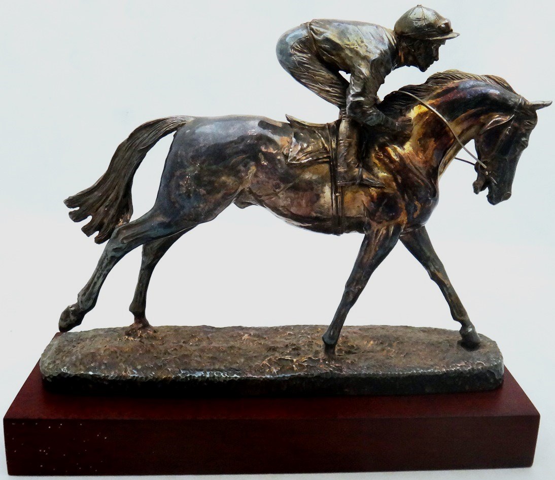 Appraisal: A silver model of a racehorse and jockey of modern