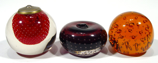 Appraisal: Three Whitefriars style bubbled glass paperweights - one apple shaped