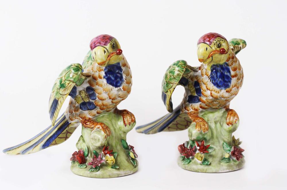 Appraisal: TWO ITALIAN PAINTED EARTHENWARE PARROTSEach colorfully painted with displayed wings