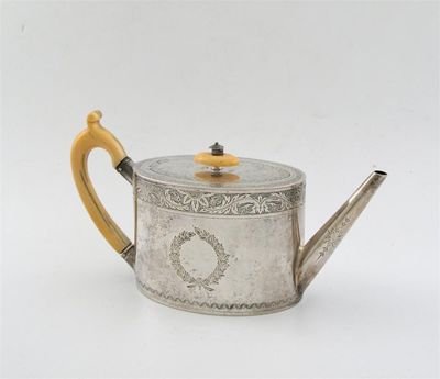 Appraisal: A Victorian bright cut oval teapot with an ivory handle