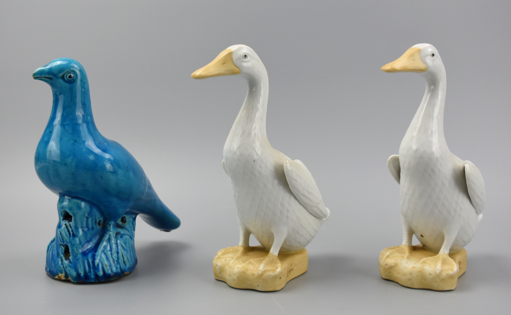 Appraisal: TWO CHINESE WHITE GLAZE GOOSE PEACOCK GLAZE DOVE a pair